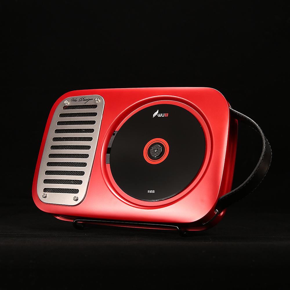 Portable CD speaker with a sleek red design, featuring a built-in CD player on the right side and a speaker grille on the left, equipped with a handle for easy carrying