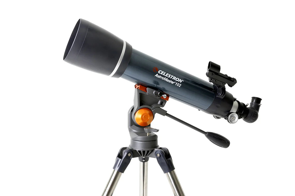 A Celestron AstroMaster 102 telescope with a blue cylindrical tube mounted on a gray equatorial mount and silver tripod. The telescope is angled slightly upward for observation.