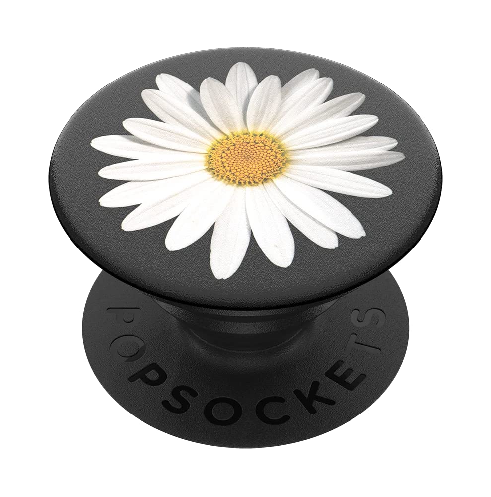 A black PopSockets phone grip featuring an expanding kickstand. The top surface is adorned with a detailed image of a white daisy with a yellow center, contrasting beautifully against the black background. The base of the grip has "POPSOCKETS" embossed in black.