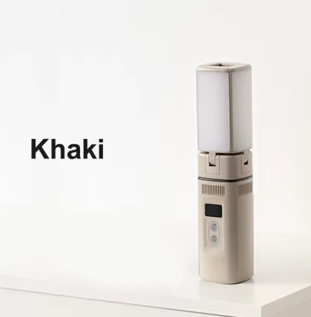 A khaki-colored portable device with a sleek design, featuring a rectangular light panel on top and control buttons with a display on the front, placed on a white surface.