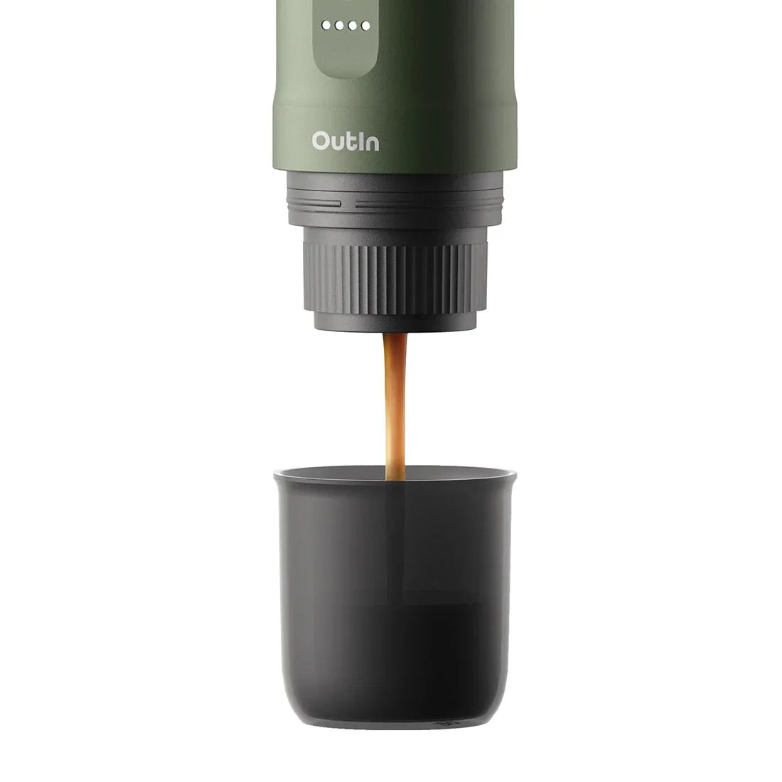 OutIn Nano Forest Green extracting espresso with crema into cup