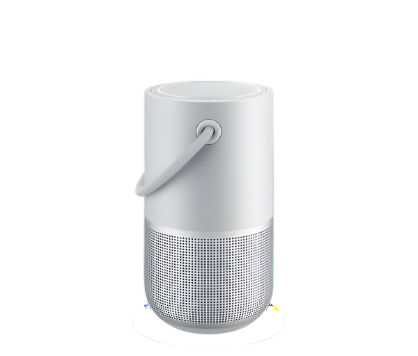 A white Bose portable speaker with a sleek cylindrical design, featuring a built-in handle for easy carrying and a 360-degree speaker grill.