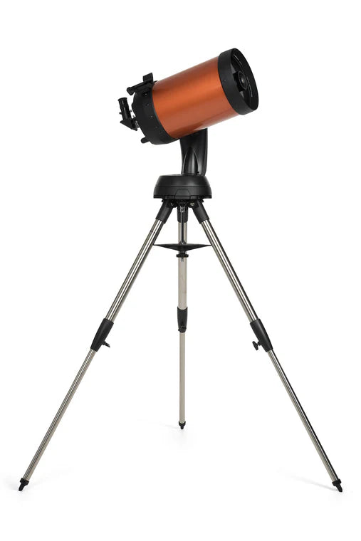  A Celestron NexStar 8SE telescope with an orange cylindrical tube mounted on a black computerized base and a silver tripod. The telescope is angled upwards for observation. The tripod provides a stable and adjustable platform, while the computerized base offers advanced tracking and alignment capabilities. The eyepiece and other controls are positioned at the back of the telescope tube. The Celestron branding and model name "NexStar 8SE" are prominently displayed on the side of the tube.