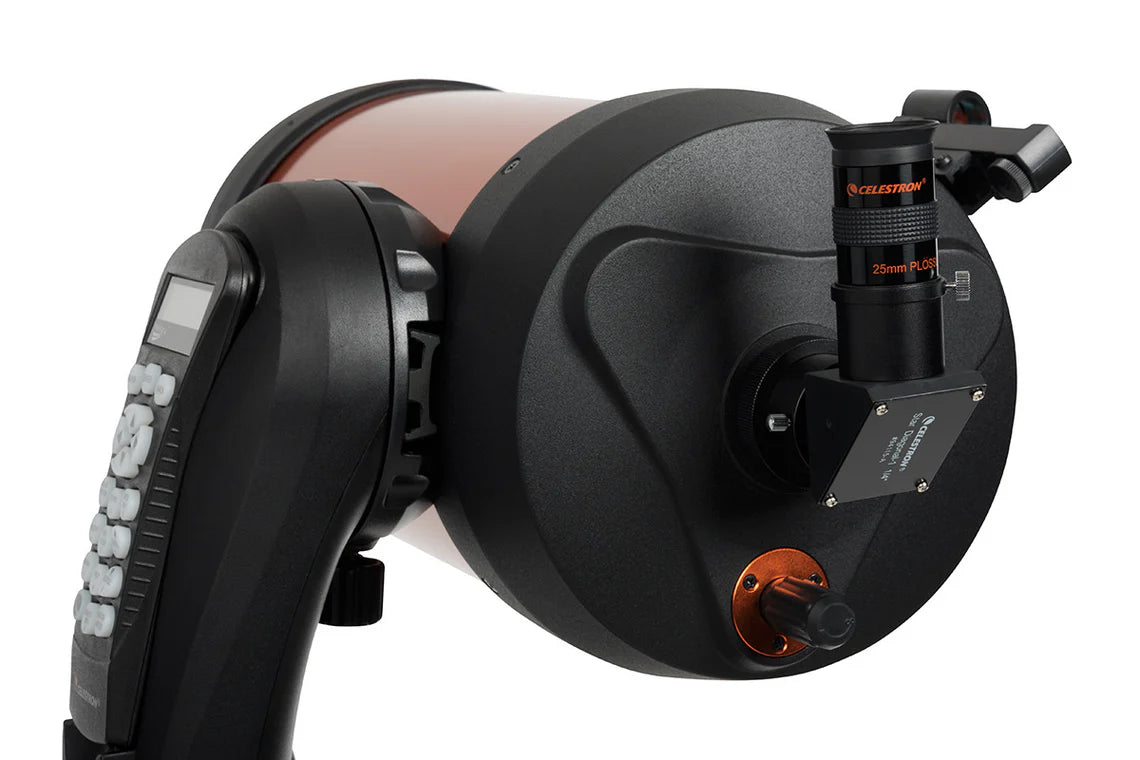  A close-up view of the back of a Celestron NexStar 8SE telescope, showing the eyepiece and focus knobs. The eyepiece is labeled "Celestron 25mm PL," and is attached to the back of the orange cylindrical tube.