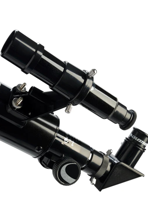 A close-up view of the eyepiece and finderscope of a Celestron PowerSeeker 50AZ telescope. The black cylindrical tube of the telescope is partially visible, with the finderscope mounted on top. The eyepiece, attached at an angle, includes a focus knob for adjusting the view.
