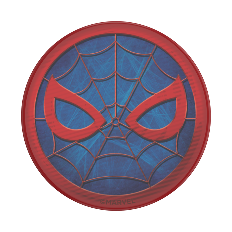 Close-up view of a PopSockets Marvel Spider-Man PopGrip for MagSafe featuring Spider-Man's mask design. The mask is red with blue webbing details and red eyes, set against a blue background. The circular emblem includes fine web lines connecting the mask elements. The emblem has a small "© MARVEL" inscription at the bottom.