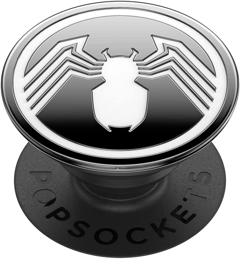 Marvel Enamel Spider-Man PopGrip featuring a black and white design of the Spider-Man emblem. The emblem shows a stylized white spider on a black background. The base of the PopGrip is black with the word "POPSOCKETS" embossed on it.