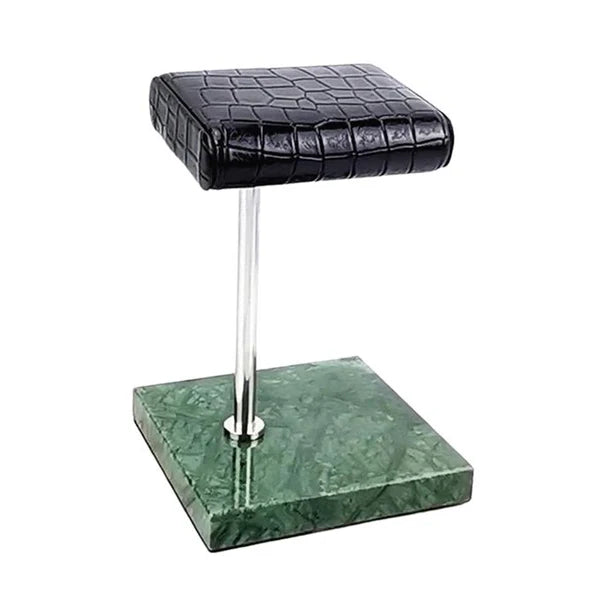 Luxury leather watch stand with a sleek chrome rod and a green marble base for elegant display.