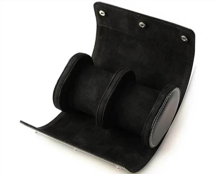 Black suede watch roll case with two compartments, ideal for keeping wristwatches safe and organized during travel.