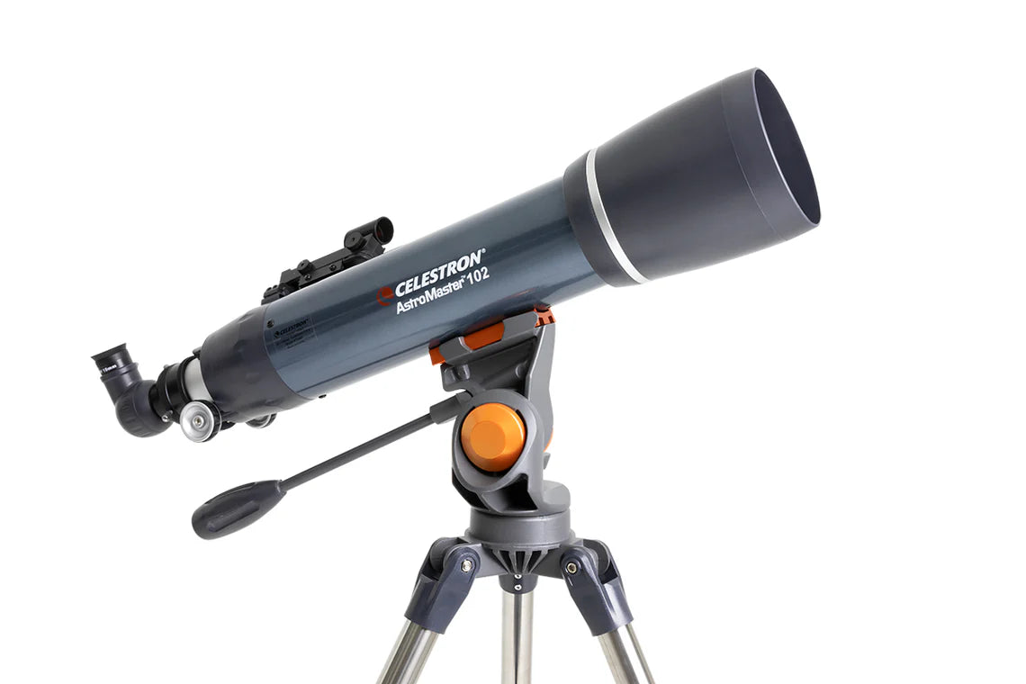  A Celestron AstroMaster 102 telescope with a blue cylindrical tube mounted on a gray equatorial mount and silver tripod. The telescope is angled slightly upward for observation.