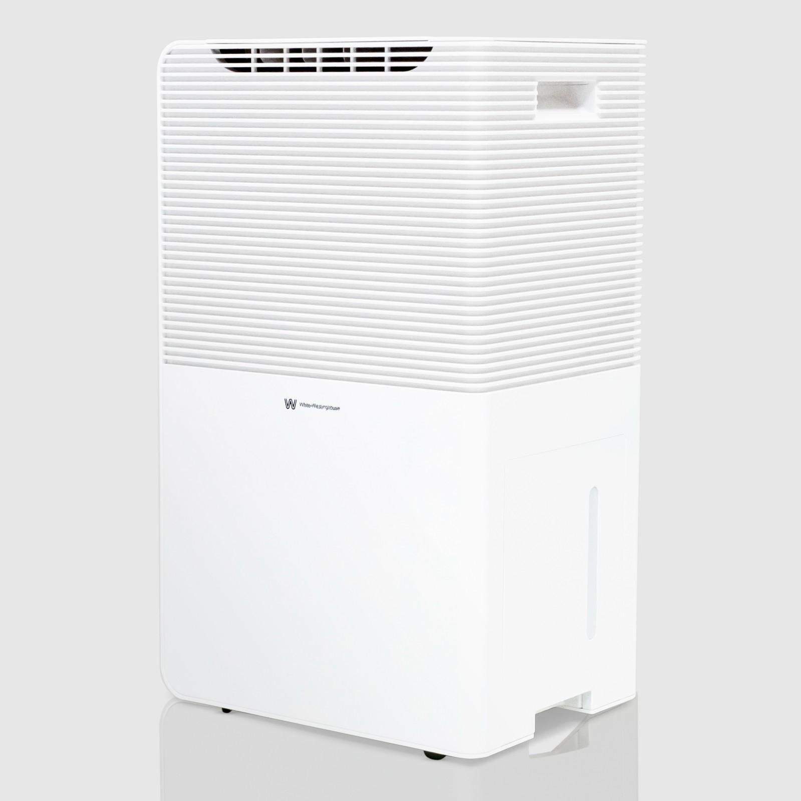 Angled view of the White Westinghouse Dehumidifier AWHD50L, showcasing the sleek white design with top air vents, built-in handle, and water tank compartment. The unit's modern and compact design is suitable for maintaining optimal humidity levels in residential and commercial spaces.