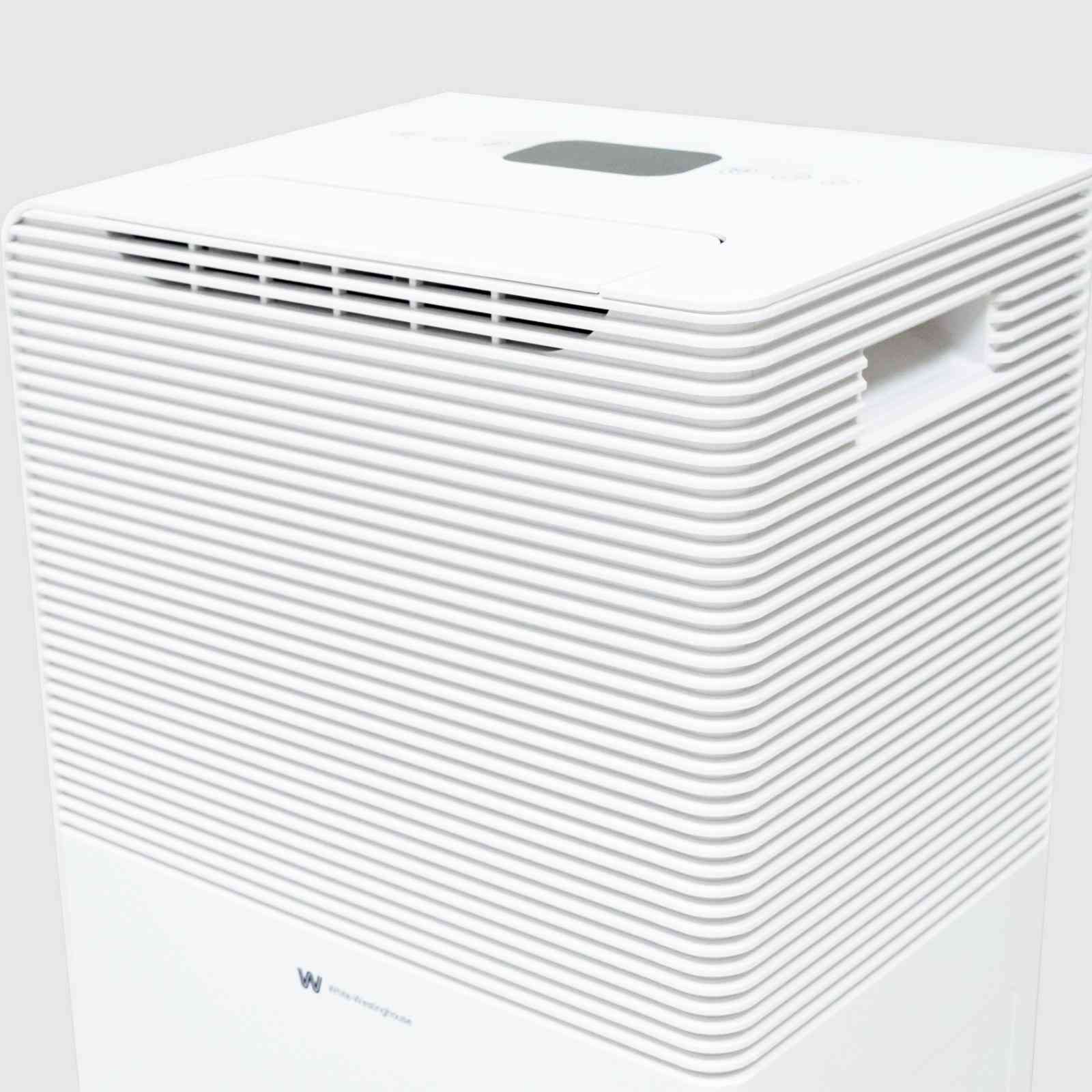 Top angled view of the White Westinghouse Dehumidifier AWHD50L, showcasing the air vents, digital control panel, and built-in handle for easy mobility. The sleek white design is suitable for maintaining optimal humidity levels in residential and commercial spaces.