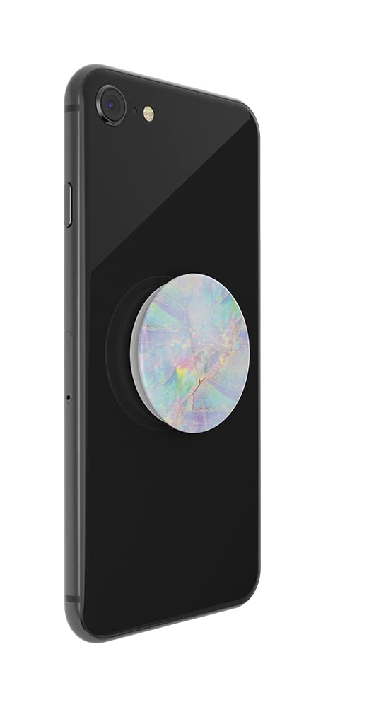  A black smartphone with a PopSockets Phone Grip with Expanding Kickstand in the Opal design attached to the back. The grip features an iridescent pattern with pastel colors such as pink, blue, green, and yellow, giving it a gemstone-like appearance. The vibrant, shimmering design contrasts with the sleek black phone, adding a touch of elegance and functionality.