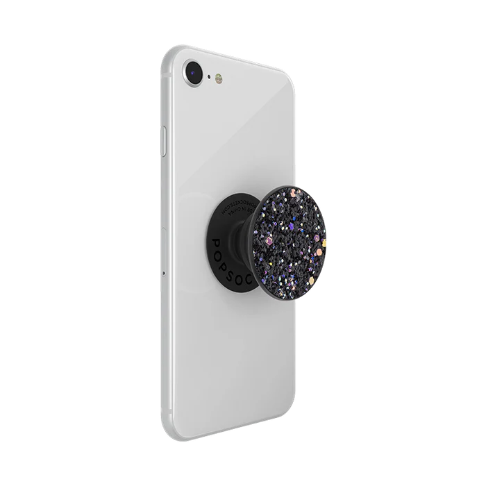 White smartphone with a PopSockets Sparkle Black PopGrip attached to the back. The PopGrip features a top covered in black glitter with multicolored reflective sparkles. The phone is shown from the back at a slight angle, with the PopGrip extended outward, highlighting its sparkly design.