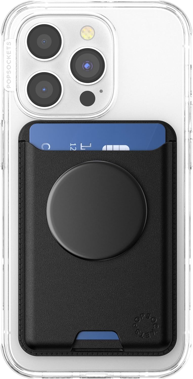 A black PopSockets Softgoods Phone Wallet with an expanding grip and adapter ring for MagSafe, attached to the back of a clear phone case. The wallet is holding a blue card, and the expanding grip is in its retracted position, viewed from the back.