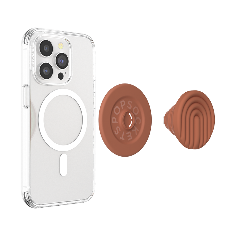  A clear phone case with a MagSafe ring is shown beside a detached PopOut Terracotta Curves PopGrip for MagSafe. The PopGrip features a terracotta-colored design with curved lines, ready to be attached to the phone case, providing a secure and stylish grip for the device