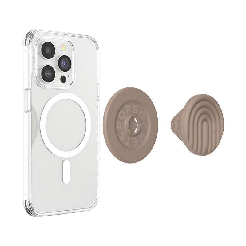  A clear phone case with a MagSafe ring is shown beside a detached PopOut Latte Curves PopGrip for MagSafe. The PopGrip features a latte-colored design with curved lines, ready to be attached to the phone case, providing a secure and stylish grip for the device