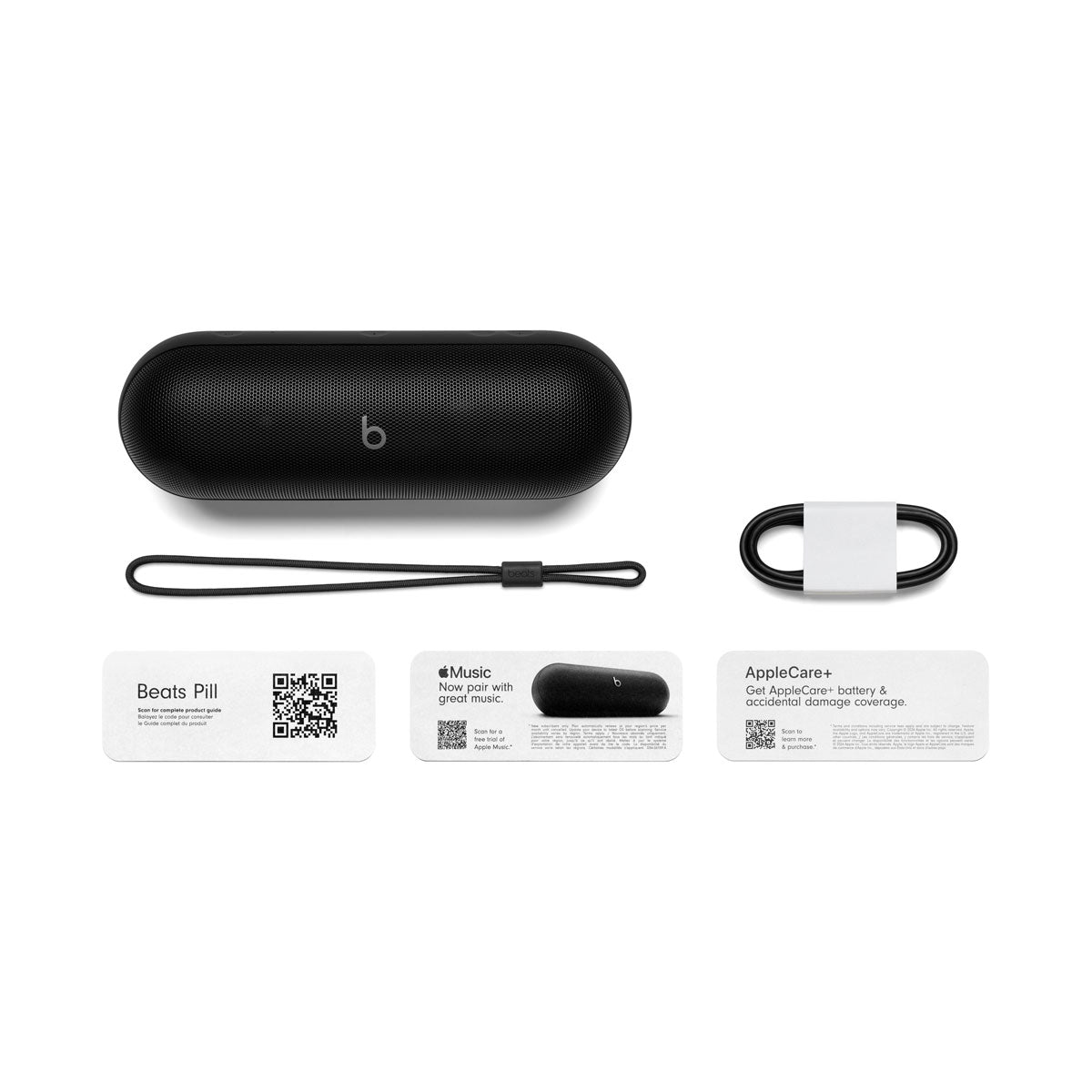 Alt text for this image:

Black Beats portable speaker displayed with included accessories: a lanyard, charging cable, and product information cards for Beats Pill, Apple Music, and AppleCare+. The setup emphasizes the full contents provided with the speaker.