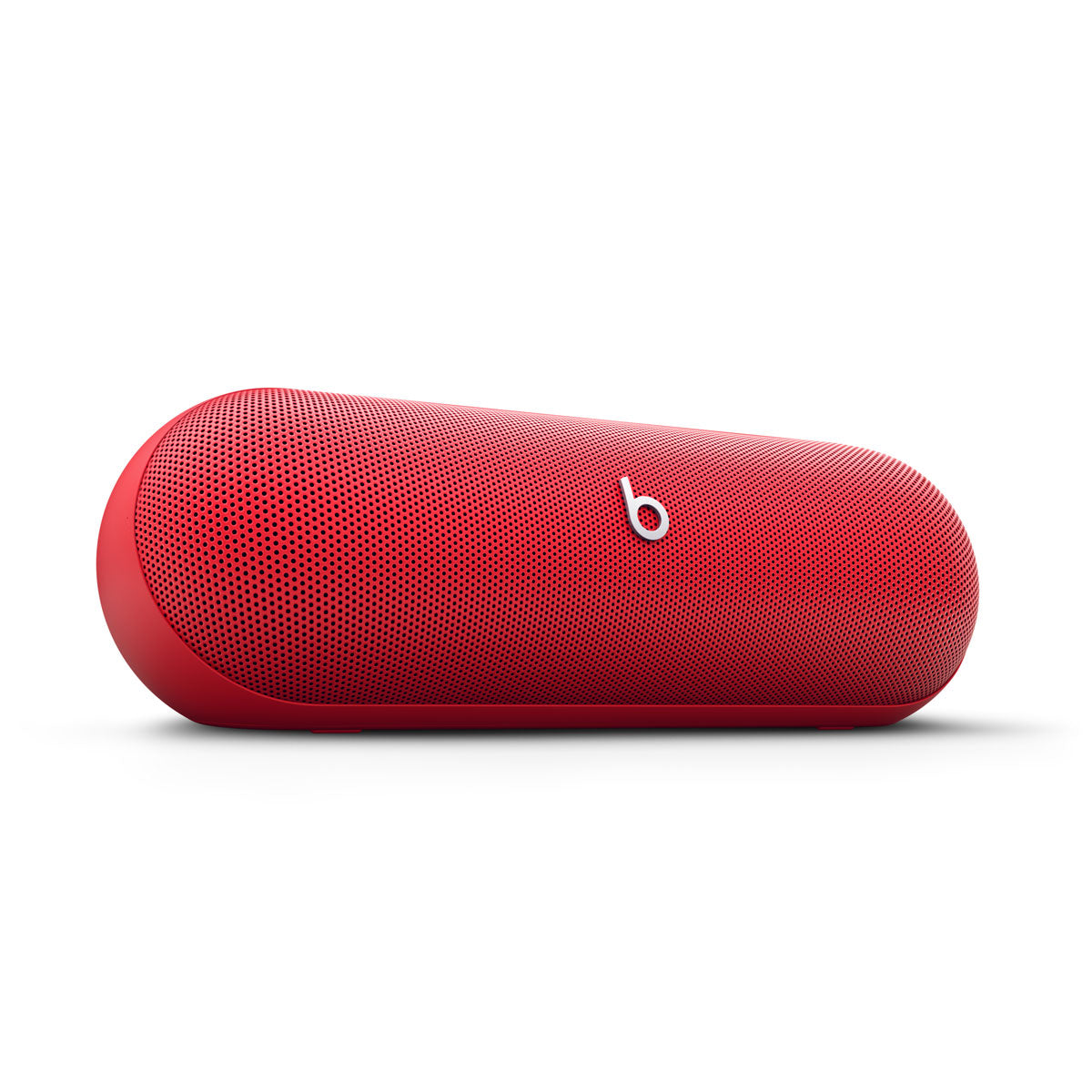 Alt text for this image:

A close-up view of a red Beats portable speaker, showcasing its sleek and minimalist design with the iconic Beats logo in the center.