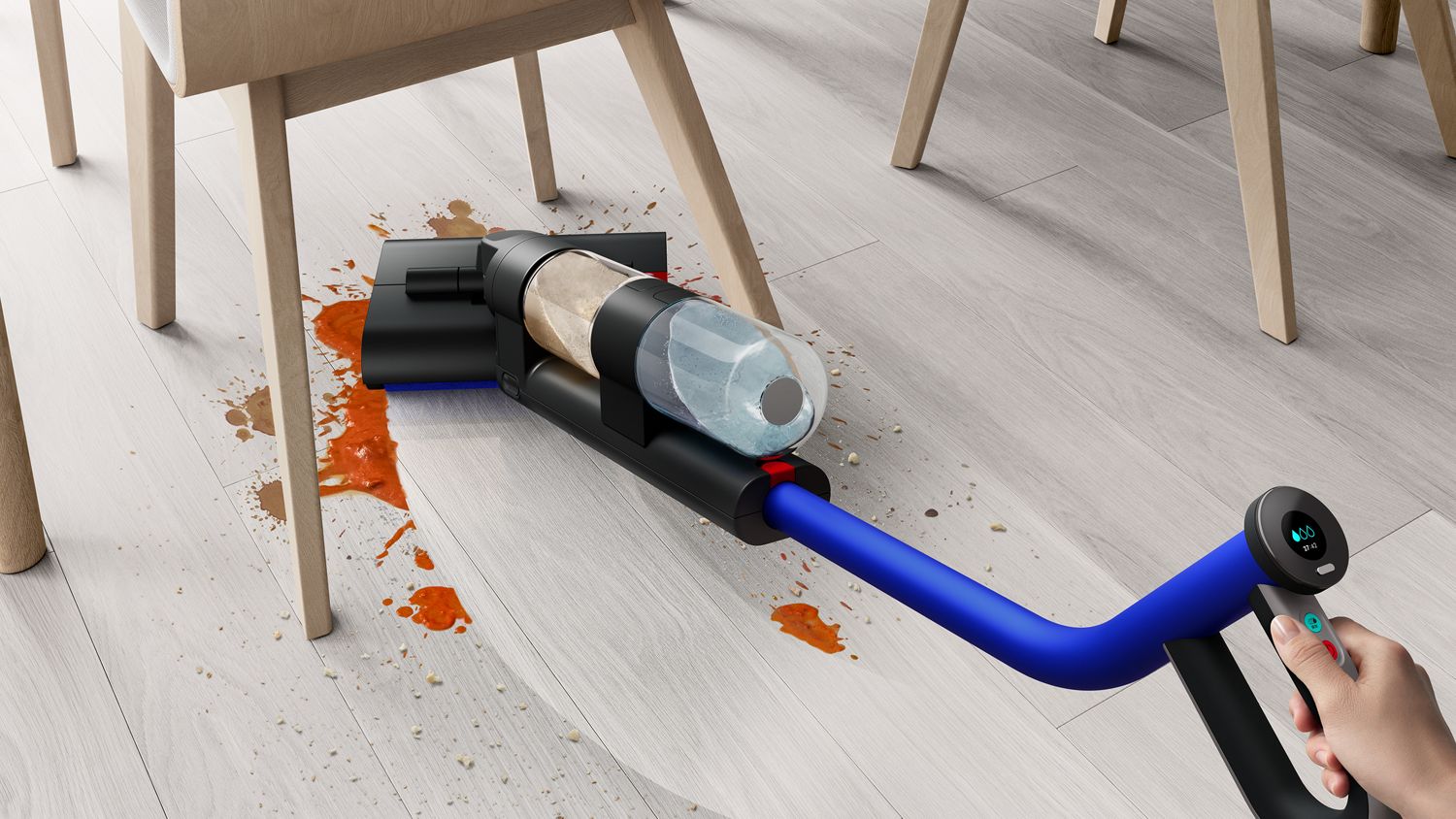 Cordless vacuum cleaner tackling a messy spill, featuring precise maneuverability and dual-tank technology for efficient cleaning of liquid and solid debris.