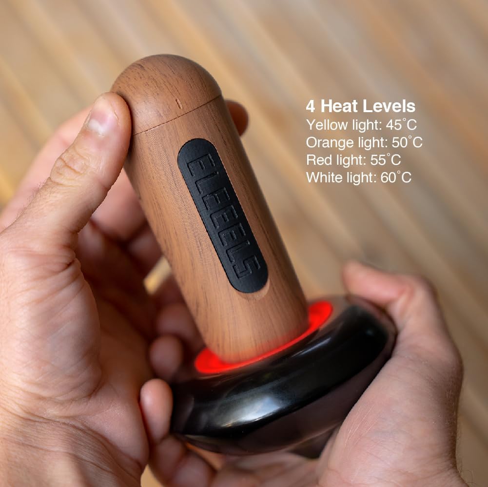 A handheld ELEEELS heating device with a wooden grip and a black rounded base, emitting a red light to indicate a heat level. The device offers four heat levels, displayed on the image: yellow (45°C), orange (50°C), red (55°C), and white (60°C). The ergonomic design is showcased in a person's hands, with a wooden surface in the background adding warmth to the scene.