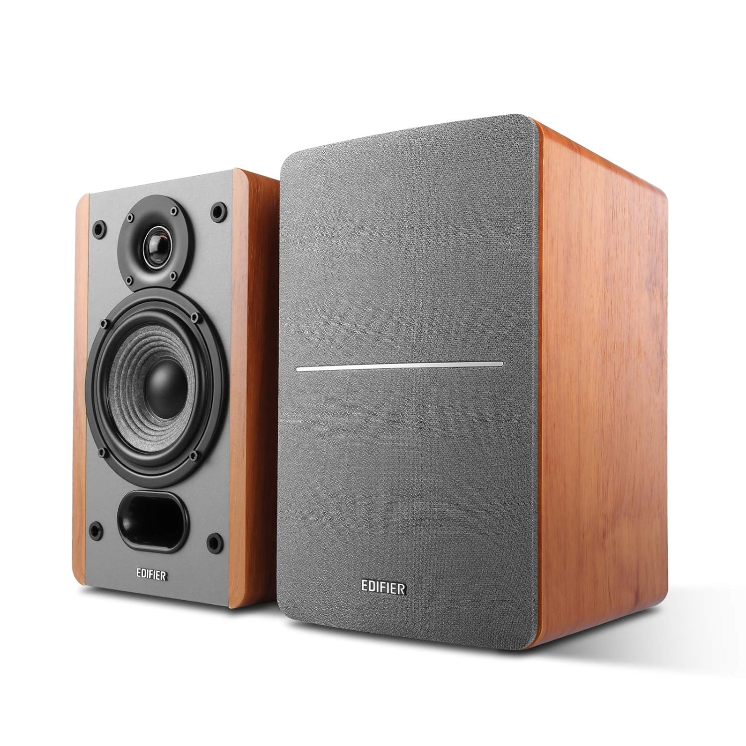 A set of Edifier wooden bookshelf speakers featuring a sleek design with one speaker showing its exposed drivers and the other with a grey fabric grille, blending modern aesthetics with classic wood craftsmanship.