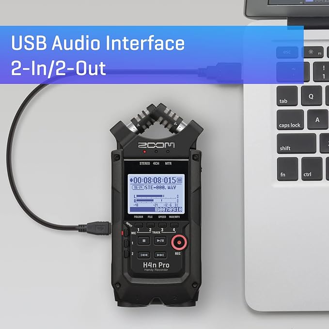 Zoom H4n Pro Handy Recorder connected to a laptop via USB, showcasing its function as a USB audio interface with 2-In/2-Out capability. The LCD screen displays recording information and control buttons are visible on the front panel.