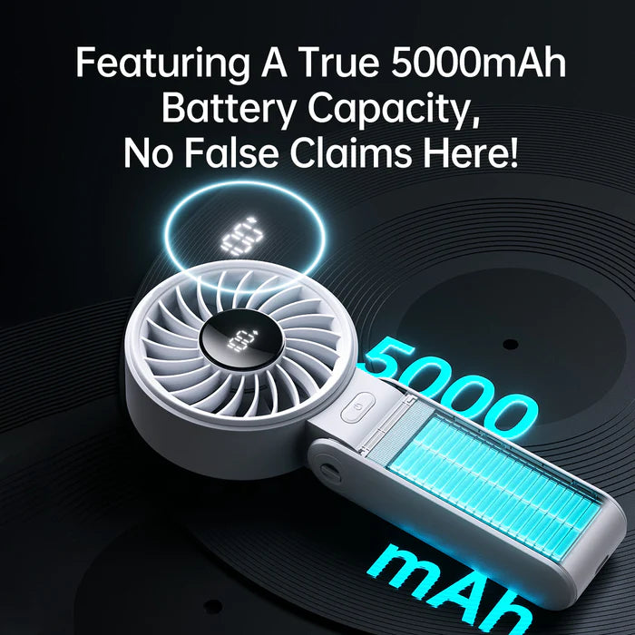 The image showcases a Jisulife portable fan with a clear focus on its 5000mAh battery capacity. The fan is partially open to reveal the battery inside, with glowing blue highlights emphasizing its power. The text above the fan reads, "Featuring A True 5000mAh Battery Capacity, No False Claims Here!" This message is aimed at assuring potential customers of the product's reliability and authenticity, reinforcing that the fan delivers on its promises with a genuine 5000mAh capacity for long-lasting use. The vi