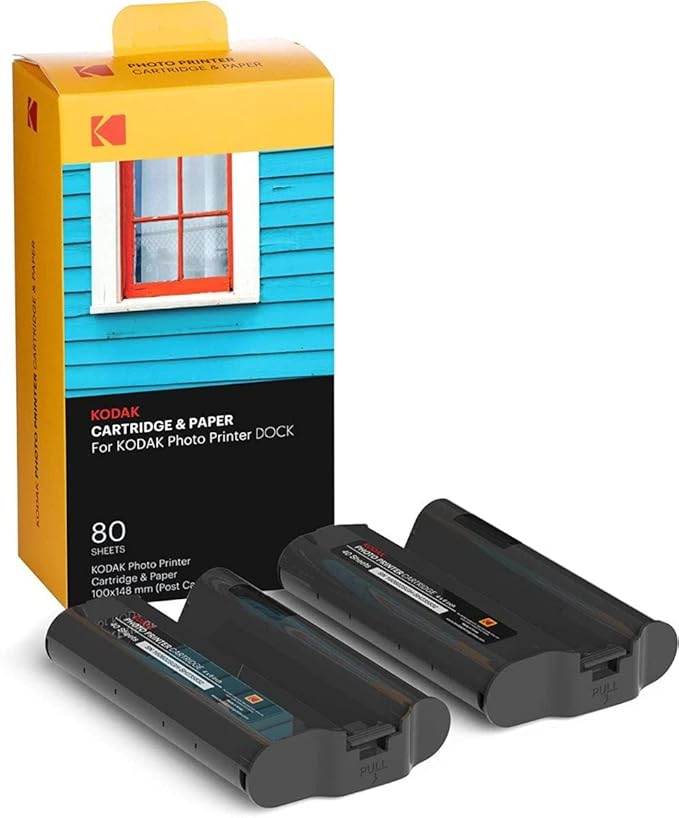 This image shows a Kodak Cartridge & Paper pack designed for the Kodak Photo Printer Dock. The package includes supplies for 80 photo prints, featuring 100x148 mm (postcard size) photo paper and two cartridges, ensuring high-quality photo printing for your needs. Let me know if you need further details!