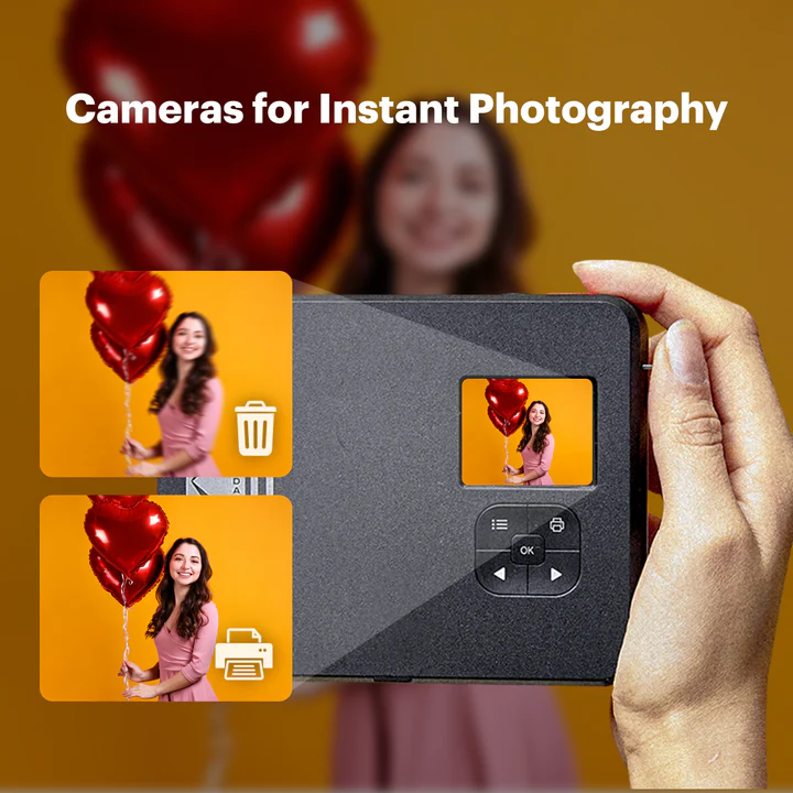 A person holds a Kodak instant camera with a small screen displaying a preview of a woman holding red heart-shaped balloons, demonstrating the ability to choose and print or delete photos before printing.