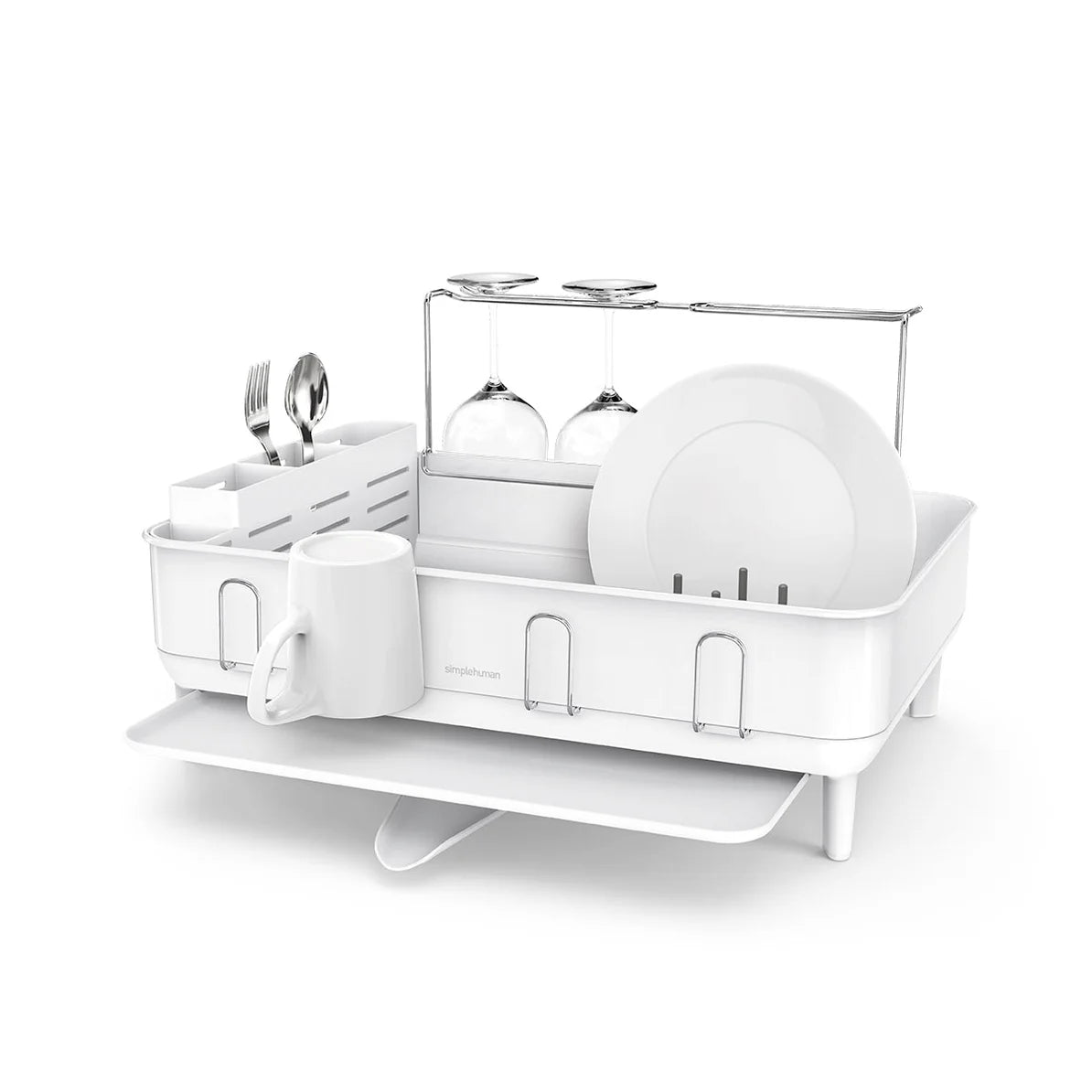 The image features a white dish drying rack with a modern design. It includes compartments for holding plates, utensils, and cups. A special section is designated for wine glasses, which are held upside down for optimal drying. The rack is elevated on legs, with an additional lower tray to catch and drain excess water, ensuring the countertop remains dry. The overall design emphasizes both functionality and a clean, minimalist aesthetic, making it a stylish addition to any kitchen.