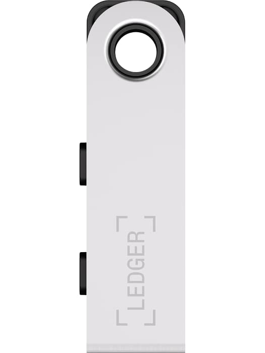 The image shows a close-up of the Ledger Nano S Plus, focusing on its front side. The device features a silver metallic finish with the "Ledger" branding engraved vertically on the front. The design is sleek and modern, with a circular hole at the top, likely for attaching a keychain or lanyard. The side buttons, which are used for navigating the device's interface, are also visible. The overall aesthetic emphasizes durability and a minimalist design, characteristic of Ledger's hardware wallets.