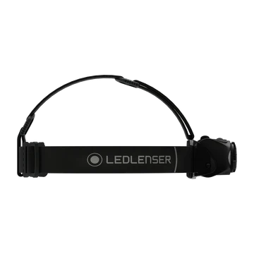 A side view of a black LED Lenser headlamp, showing the adjustable headband with the LED Lenser logo printed on it. The headlamp features an adjustable strap for a secure fit and a tilting lamphead for directing the light. The design is sleek and functional, suitable for various outdoor activities.