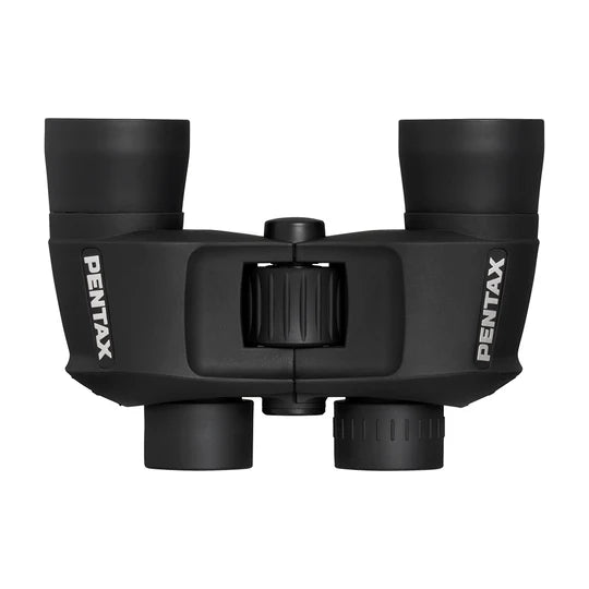  A top-down view of Pentax SP 8x40 WP binoculars. The binoculars have a rugged black design with the Pentax logo printed on both barrels. The central focusing wheel is prominently positioned between the barrels. The eyepieces are designed for comfortable viewing, and the overall build emphasizes durability and ease of use. The binoculars feature a textured surface for a secure grip.