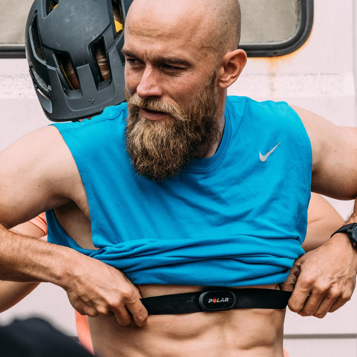 Athlete wearing a Polar heart rate monitor chest strap, showcasing fitness tracking technology in action.