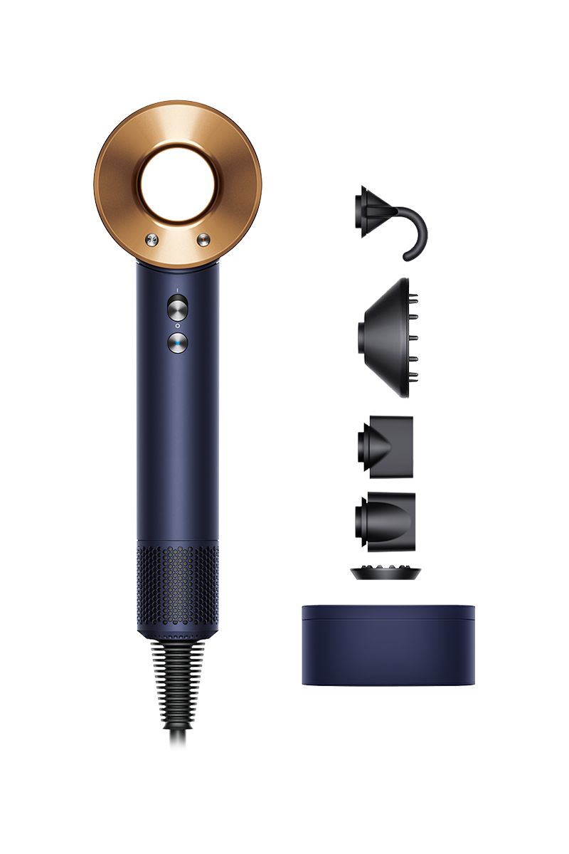 This image shows a navy and gold hairdryer along with various attachments displayed beside it. The attachments include a curl-enhancing hook, a diffuser for even airflow, a concentrator nozzle for precise styling, and other tools to customize hair drying and styling. The set also features a compact storage case, ensuring that the components are organized and easily accessible. The design emphasizes both functionality and elegance, appealing to those who value a premium styling experience.