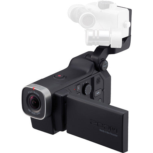 Zoom Handy Video Recorder with a compact, ergonomic design featuring a wide-angle lens, adjustable flip-out LCD screen, and various control buttons and dials, shown in a side view with additional accessory mount on top.