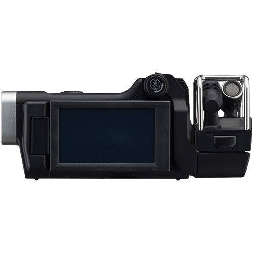 Rear view of the Zoom Q8 Handy Video Recorder with the LCD screen in a closed position, showcasing the compact design and the microphone mount on the top.