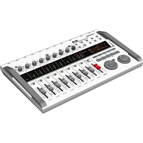 Angled view of the Zoom R16 multi-track recorder, highlighting the eight channel sliders, control knobs, digital display, and input/output ports. The device features a white design with gray side handles, and an orange-lit screen, providing a comprehensive control panel for audio recording and mixing.