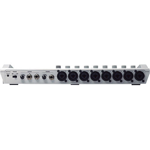 Rear view of the Zoom R16 multi-track recorder showcasing the various input and output ports, including eight XLR/TRS combo jacks, two guitar/instrument inputs, a power switch, and additional connectivity options for microphones, headphones, and other audio equipment.