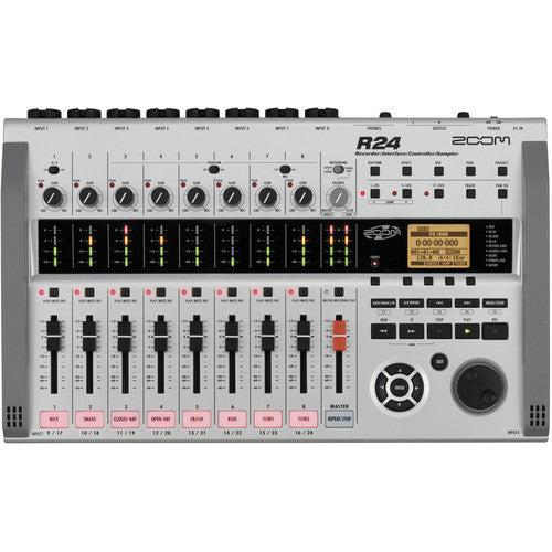 - Top-down view of a Zoom R24 multi-track recorder and audio interface, displaying its entire control panel. The device includes various faders, knobs, input channels, an LCD screen, and multiple control buttons, designed for professional audio recording and mixing.