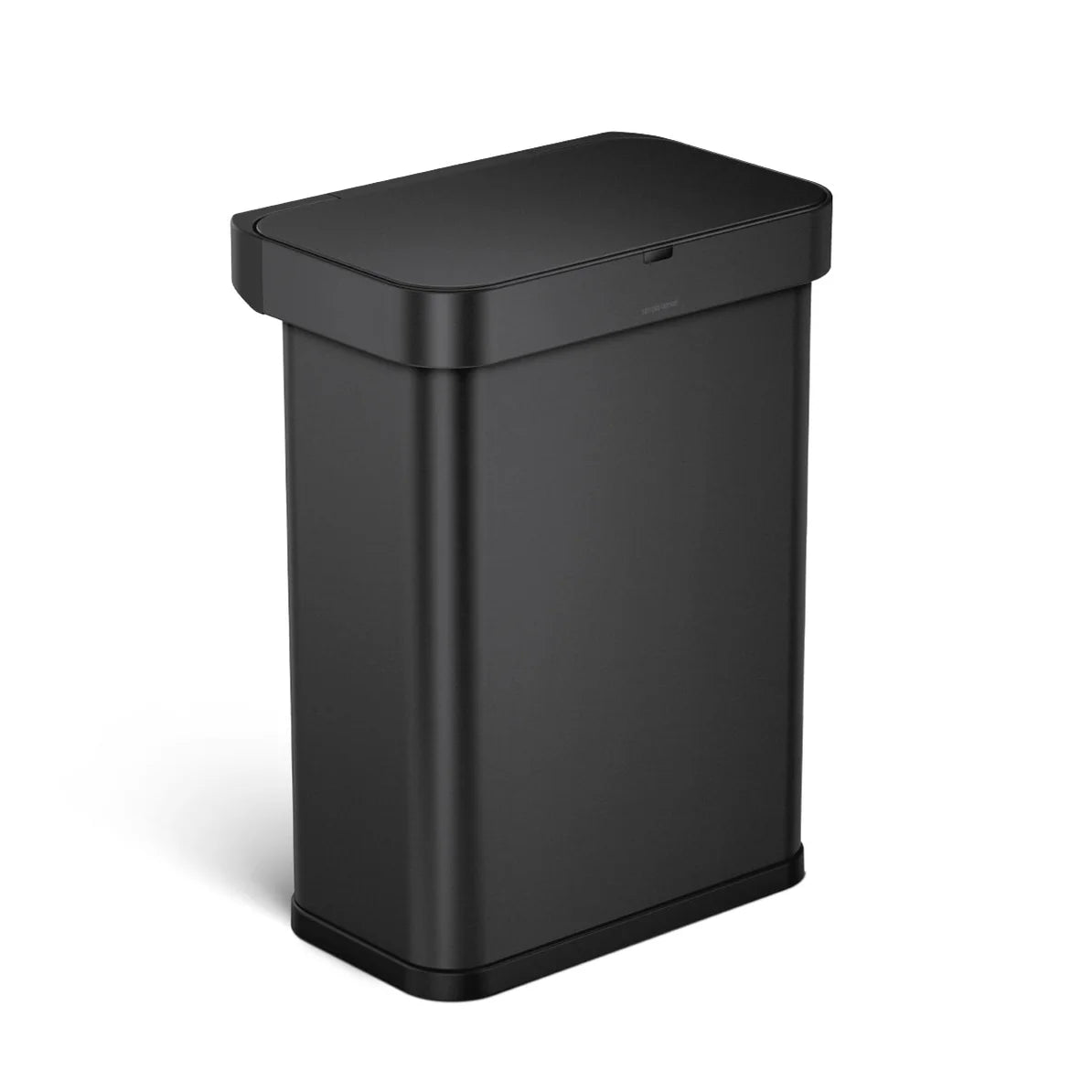 The image shows a Simplehuman trash can with a matte black finish, viewed from an angled perspective. The trash can has a rectangular shape with rounded corners, and the lid is closed, presenting a sleek and minimalist appearance. The matte black finish gives the trash can a modern and sophisticated look, making it an ideal addition to contemporary spaces such as kitchens, bathrooms, or offices. The design is both functional and aesthetically pleasing, with the clean lines and understated color allowing it 