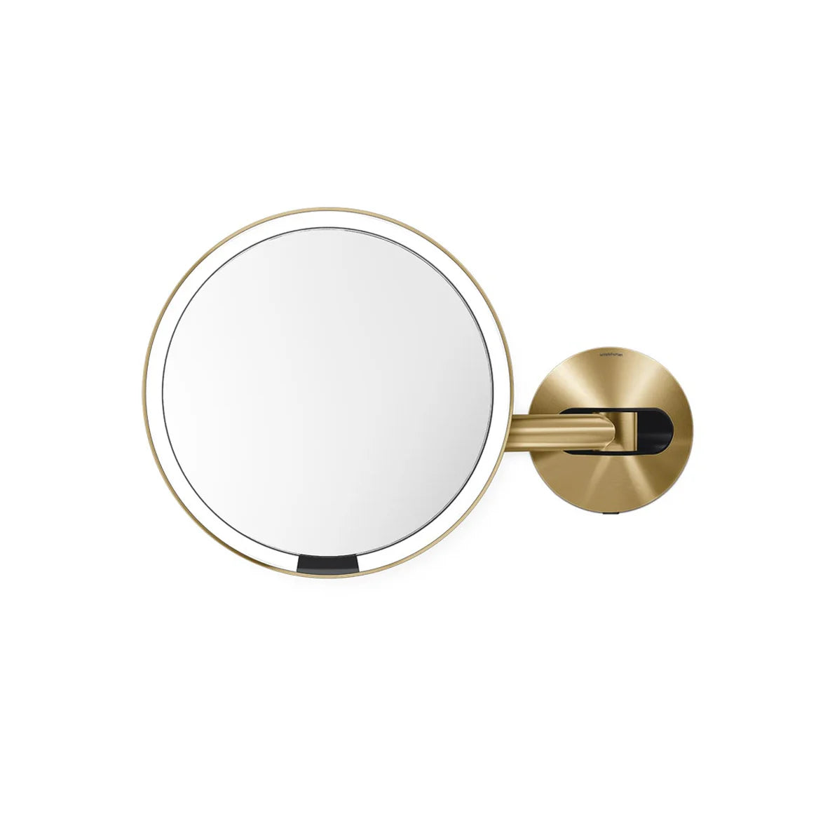 The image shows a round wall-mounted mirror with a sleek design, featuring a polished gold frame. The mirror is attached to a matching gold adjustable arm and mount, providing both functionality and a touch of luxury. The minimalist design makes it an elegant addition to any bathroom or vanity area. The adjustable arm allows for easy movement and positioning, ideal for grooming, makeup application, or close-up tasks. The gold finish adds a sophisticated and modern touch to the overall design.