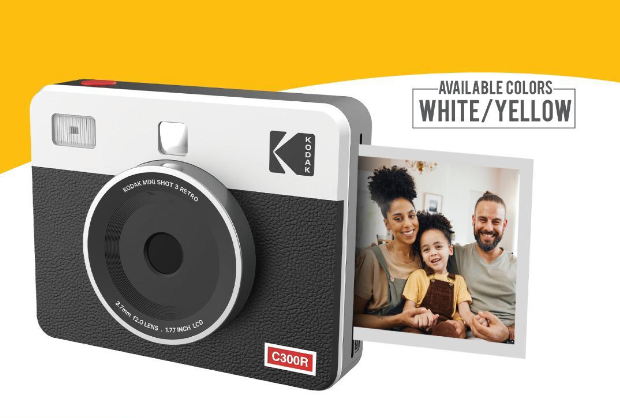 A **Kodak C300R Instant Camera** in a white and black retro design, printing a photo of a smiling family, with a label indicating available colors in **white and yellow**.