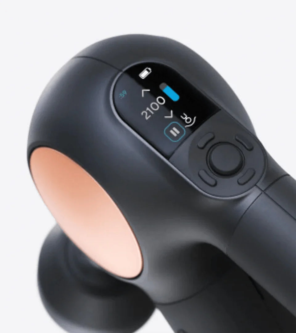 Angled view of a massage device showcasing its digital display with speed settings, battery level indicator, and ergonomic button controls for customizable muscle therapy sessions.