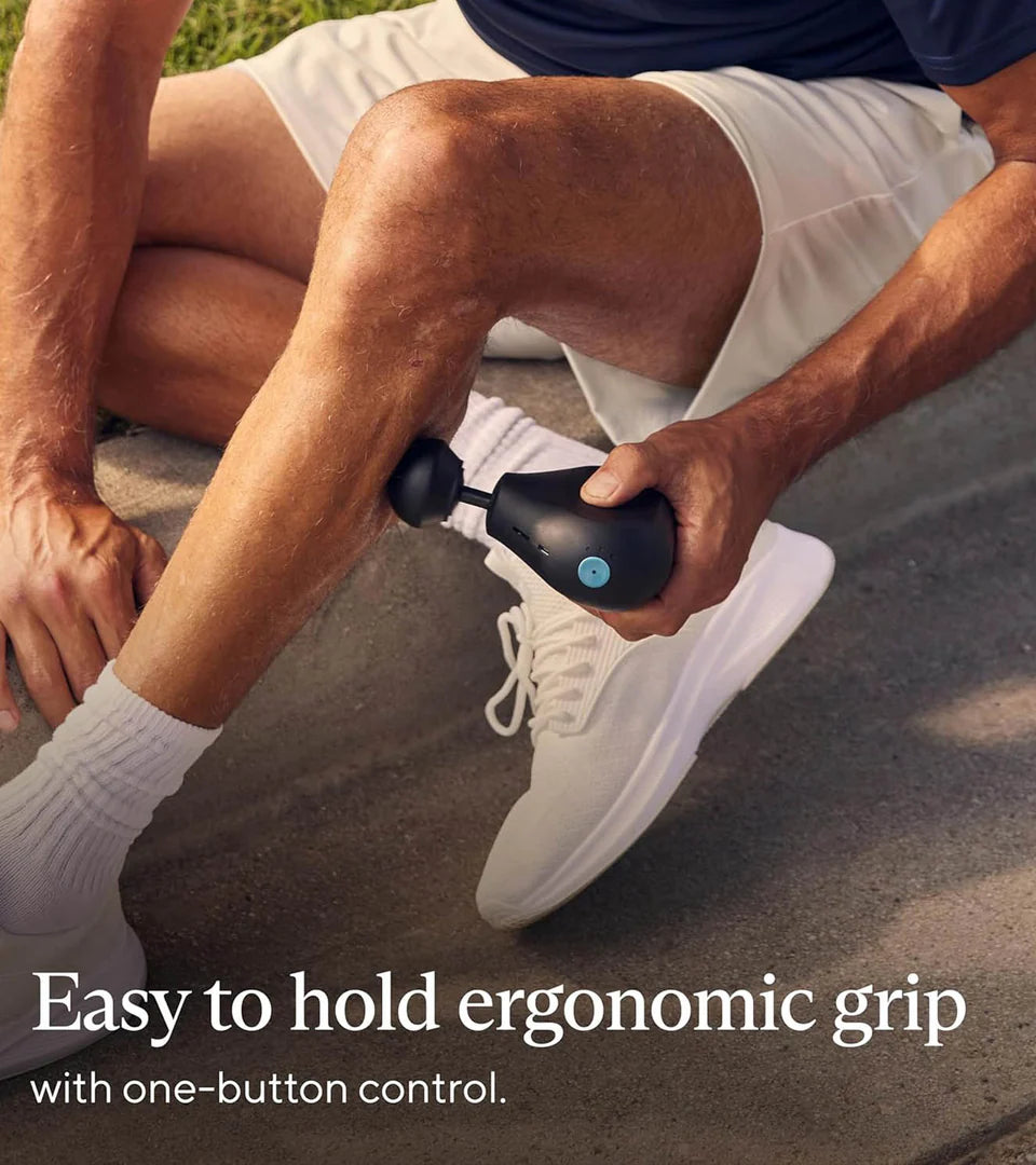 A person using a Therabody portable massage device on their leg, showcasing its ergonomic grip and one-button control for ease of use during targeted muscle recovery.