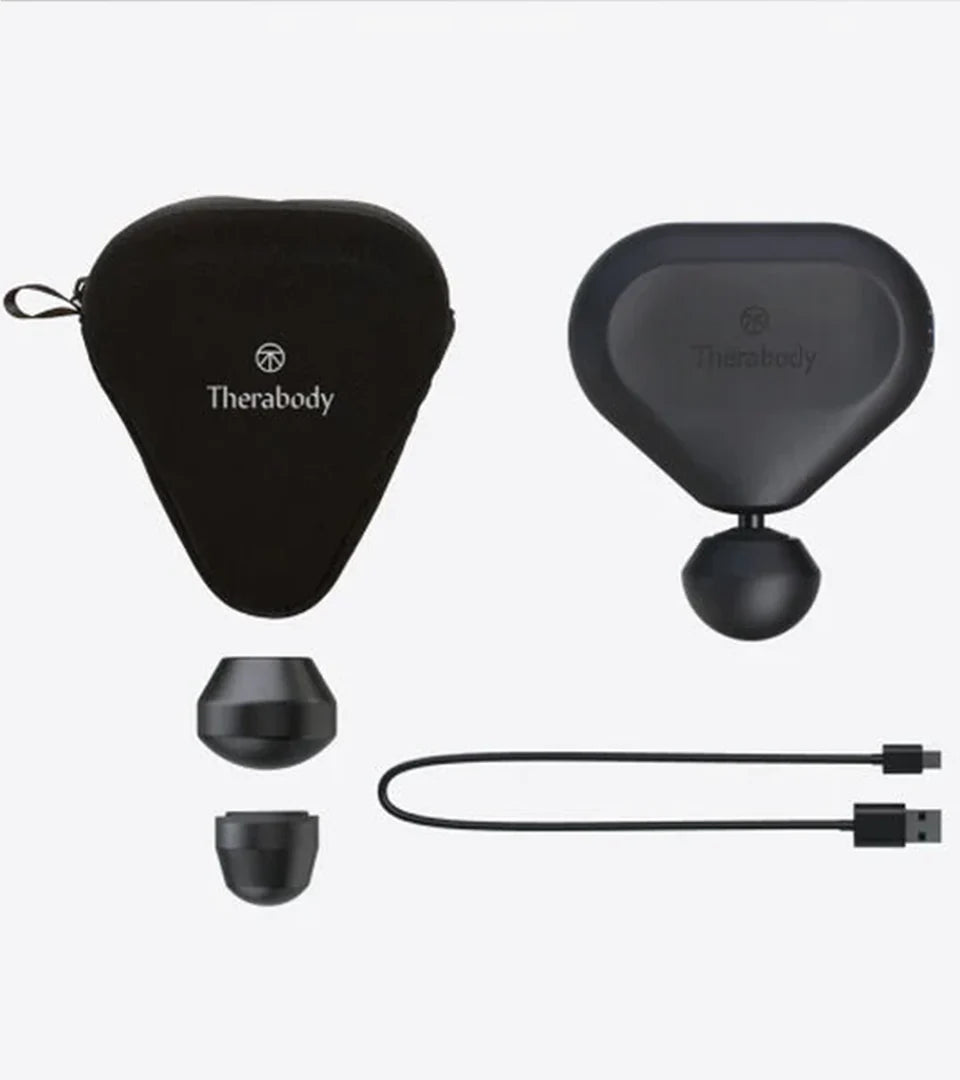 Therabody portable massage device set including the main device, two interchangeable attachments, a USB charging cable, and a compact carrying case, designed for convenient on-the-go muscle relief and recovery.