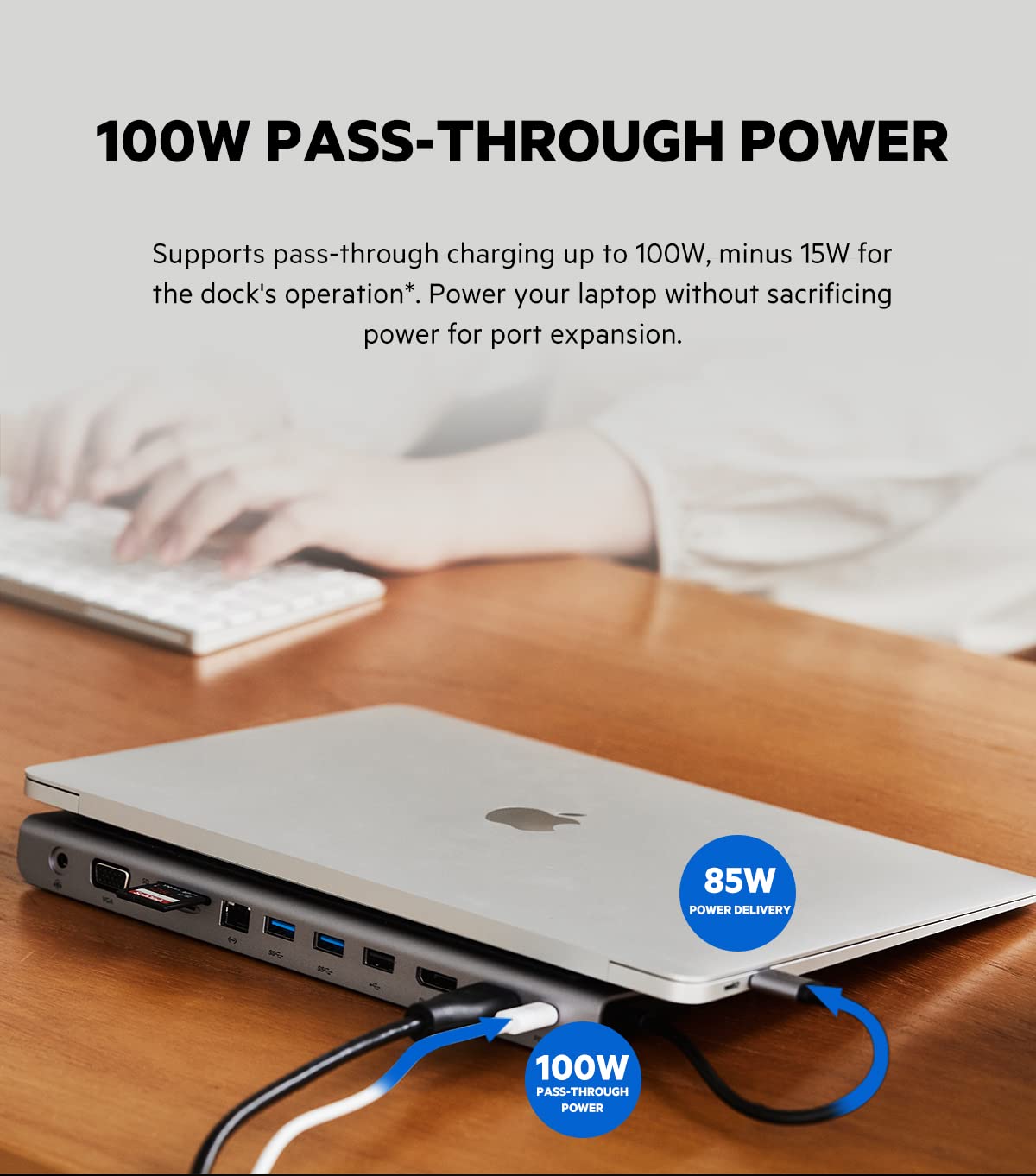 ALT: "Belkin multiport dock connected to a laptop showing pass-through charging. The text above the image reads '100W PASS-THROUGH POWER,' highlighting the dock's ability to support pass-through charging up to 100W, with 15W reserved for the dock's operation. The dock powers the laptop without sacrificing power for port expansion."