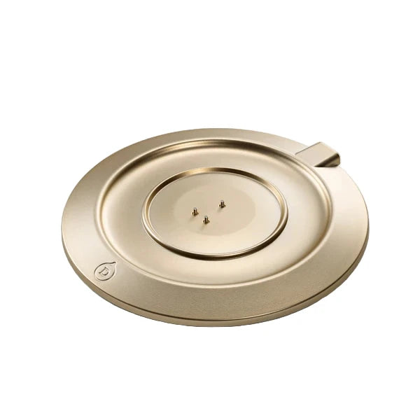 Gold-colored metal object on a white background