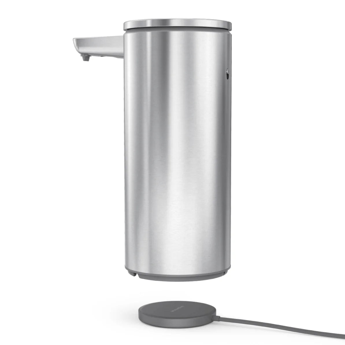 A sleek, cylindrical stainless steel automatic soap dispenser with a modern design. The dispenser has a sensor near the spout for touchless operation and is accompanied by a round charging base connected via a cable. The overall appearance is minimalist and contemporary.